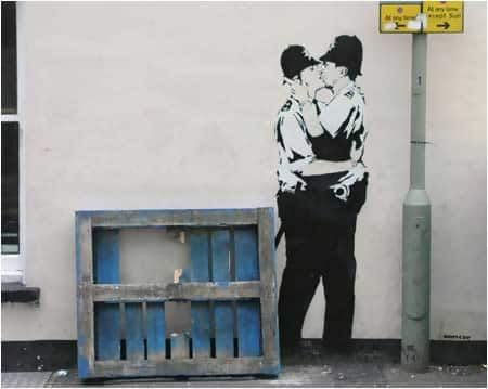 Macintosh HD:Users:brittanyloeffler:Downloads:Upwork:Banksy:banksy-graffiti-art-kissing-coppers.jpg