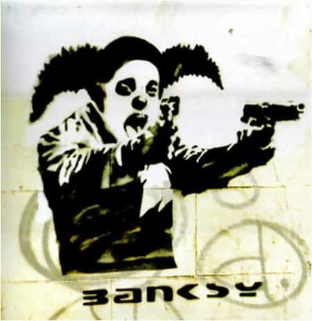 Macintosh HD:Users:brittanyloeffler:Downloads:Upwork:Banksy:clown-with-guns.jpg