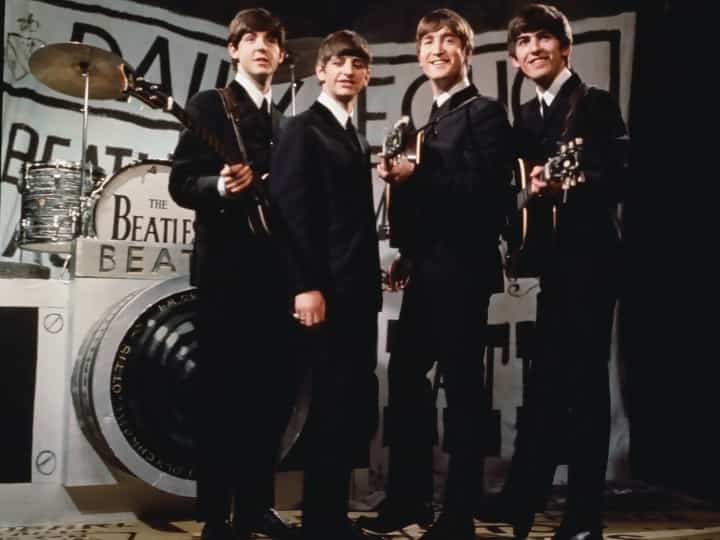 25th November 1963: Liverpudlian beat combo The Beatles, from left to right Paul McCartney, Ringo Starr, John Lennon (1940 - 1980), and George Harrison (1943 - 2001), performing in front of a camera-shaped drum kit on Granada TV's Late Scene Extra television show filmed in Manchester, England on November 25, 1963.